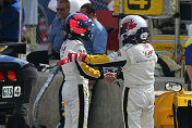 Ron Fellows congratulates No. 4 Corvette driver, Oliver Gavin  after he took the GTS pole in Friday's Chevy presents Petit Le Mans  qualifying