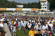 Crowded Grid as fans check out cars before start of the race