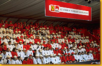 Tifiosi of the "Ferrari World Club", dressed in red and white. The seat arrangement made them form the letters "F2001"