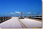 Old wooden bridge from Marathon Key to Piegon Key, White/Red 512 TR driven by Rodin and Lori Younessi