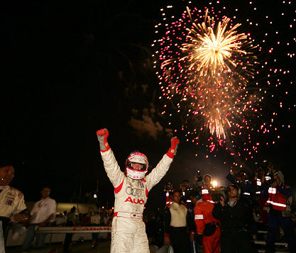 Champion Audi driver Marco Werner stands proud after winning the Chevy presents Petit Le Mans with co-driver JJ Lehto