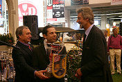 G&ouml;tz Seidel & Helmut Eberlein being handed over the prize for the official Ferrari Display
