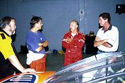 (Center) Track Director Bob Zinell and Chief driving instructor Terry Earwood discuss set up's on the ex-Jeff Gordon NASCAR Chevrolet