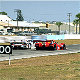 The 333 SP s/n 025 of Didier Theys, Mauro Baldi and Fredy Lienhard overtakes the Porsche GT1 of Boutsen/Wollek/Muller