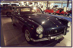 250 GTE shown in the Nicolis Car Museum in Villafranca di Verona, is a 3rd series, Chassis 4299GT, with Italian License VR.760000, dark bluemetallic over tobacco leather and beige carpets