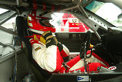 Danny Sullivan buckles into his Ferrari before heading out on the  track.