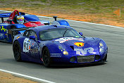 Female racer Amanda Stretton of England steers the #92 TVR as Jon  Field overtakes her in the Intersport Lola B160-Judd.
