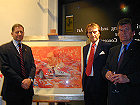 Jody Scheckter, Luca di Montezemolo and Richard Mackay with specially commissioned 40th anniversary painting depicting all the cars raced by the MC team, artist Craig Warwick.