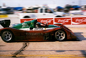 Juan Fangio II exits the pits in the Doyle-Risi 333 SP s/n 018.  He retains his 3rd place spot in the race.