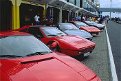 Lots of Ferrari parking in the pit Lane