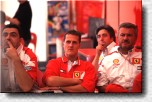 Michael Schumacher and his manager Willy Weber watching soccer 