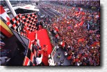 An enthusiastic crowd celebrates the Ferrari victory 