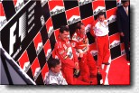 Michael Schumacher, David Coulthard and Jacques Villeneuve on the podium 
