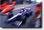 Olivier Panis close to a Ferrari ... in the pit lane