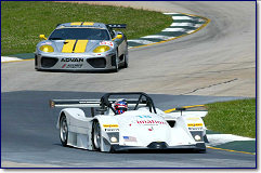 The Essex Racing Lola-Millington Prototype (front) leads the ACEMCO Ferrari 360 Modena through Road Atlanta's "S" turns during Tuesday's American Le Mans Series testing session.