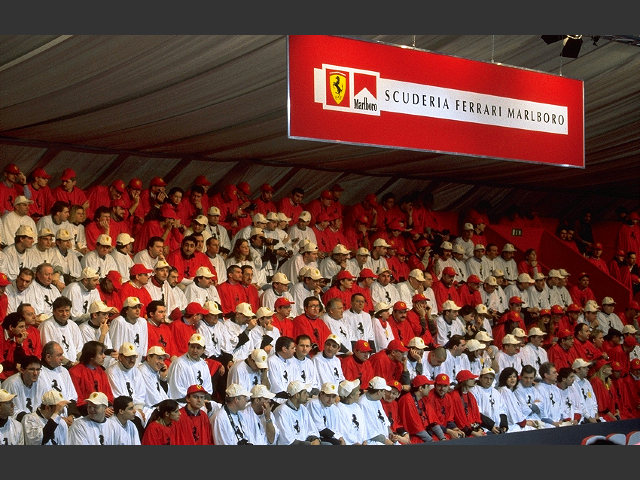 Tifiosi of the "Ferrari World Club", dressed in red and white. The seat arrangement made them form the letters "F2001"