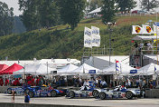 LMP class sports cars of the American Le Mans Series  getting ready for practice
