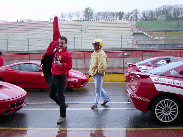 Gordon De Adamich, an other instructor. The pace cars are 'slow' Alfas, but these guys sure know how to drive 'em