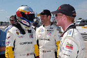 Ron Fellows (in helmet), the GTS class fastest qualifier, with  Corvette teammates Max Papis and Johnny O'Connell