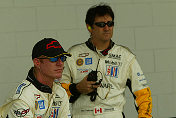 Johnny O'Connell (left) and Ron Fellows observe as their  Corvette teammate Max Papis runs some laps