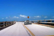 Old wooden bridge from Marathon Key to Piegon Key, White/Red 512 TR driven by Rodin and Lori Younessi