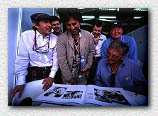 Jackie Stewart and George Harrison view the new Schlegelmilch book 