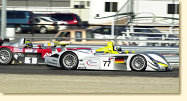 Panoz #1 driven by Jan Magnussen behind Audi R8 #77