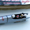 Swapping an Audi racer for an Audi bobsled: Rinaldo Capello (second from left) and Tom Kristensen (third from left) riding down the Olympic run in St. Moritz