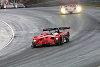 Early battle for the lead in the rain between Jan Magnussen, Panoz LMP1-RS  and Frank Biela, Audi R8