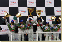 The podium at Donington, f.l.t.r. 2nd, 1st and 3rd - Frank Biela, Emanuele Pirro, Tom Kristensen, Rinaldo Capello, Guy Smith and Stefan Johansson