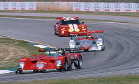 Brabham leads Pirro in the early stages of the race, shortly before EP pased the #1 Panoz